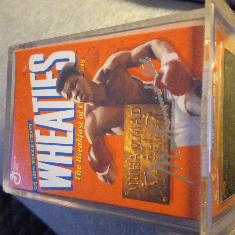 Muhammad Ali wheatie box in a plastic case
